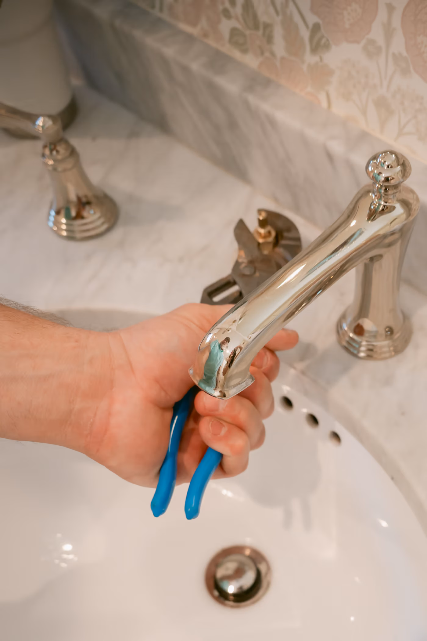 A close view of a plumbing fixture during service
